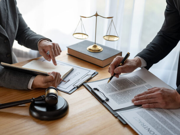 Services Page - Lawyers Lawyer, legal advisor, businessman brainstorming information on agreement details Business contracts in legal processing books for accuracy in contract documents. joint financial investment.
